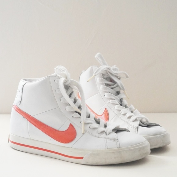 white and orange nike high tops